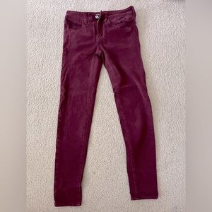Dark maroon skinny jeans